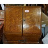 An Edwardian golden oak slope front correspondence box with fitted interior and base drawer, width