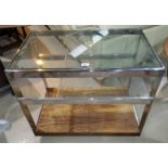 A 1960's chrome glass and rosewood drinks trolley by Merrow Associates, having glass top and