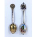 A hallmarked silver teaspoon with ornate crest terminal, the bowl with enamel of The Old Canonbury