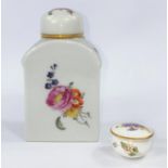 A miniature Royal Worcester lidded pot with floral decoration diameter 3.5cm and a similar ceramic