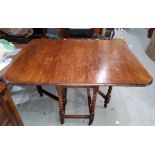 A 1920's oak drop leaf table with barley twist supports, 135 x 103 cm extended, a set of 6 chairs