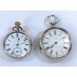 A hallmarked silver pocket watch, open face and key wound, by John Taylor, Rochdale; a similar watch