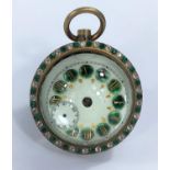 An early 20th century time piece with spherical case set with green and clear stones, with green and