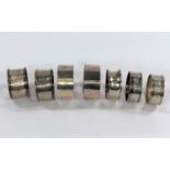 Nine hallmarked silver various napkin rings, various dates and assay offices, 4.25