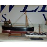 A model of a fishing boat with hold, lifeboat 45cm etc another model of a vintage lifeboat, 23cm