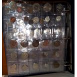A collection of coins from islands around the world in album:  Ceylon; Samoa; New Guinea and others,