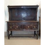 A carved oak dresser of 18th century origins with raised back shelf on turned columns, 2 drawers