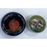 A MOORCROFT miniature bowl decorated with an Iris, 8cm and a pomegranate pattern pin dish, 11cm