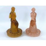 Two 1930's coloured frosted glass table centres of seated semi-clad ladies on columns, pink and