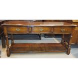 An 18th century style distressed oak dresser base in the manner of Titchmarsh & Goodwin, with 3