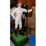 A late 19th / early 20th century cast iron 'hitching post' / Lawn Jockey in the form of a jockey