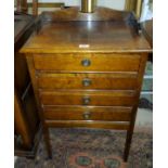 An Edwardian mahogany 4 height music cabinet