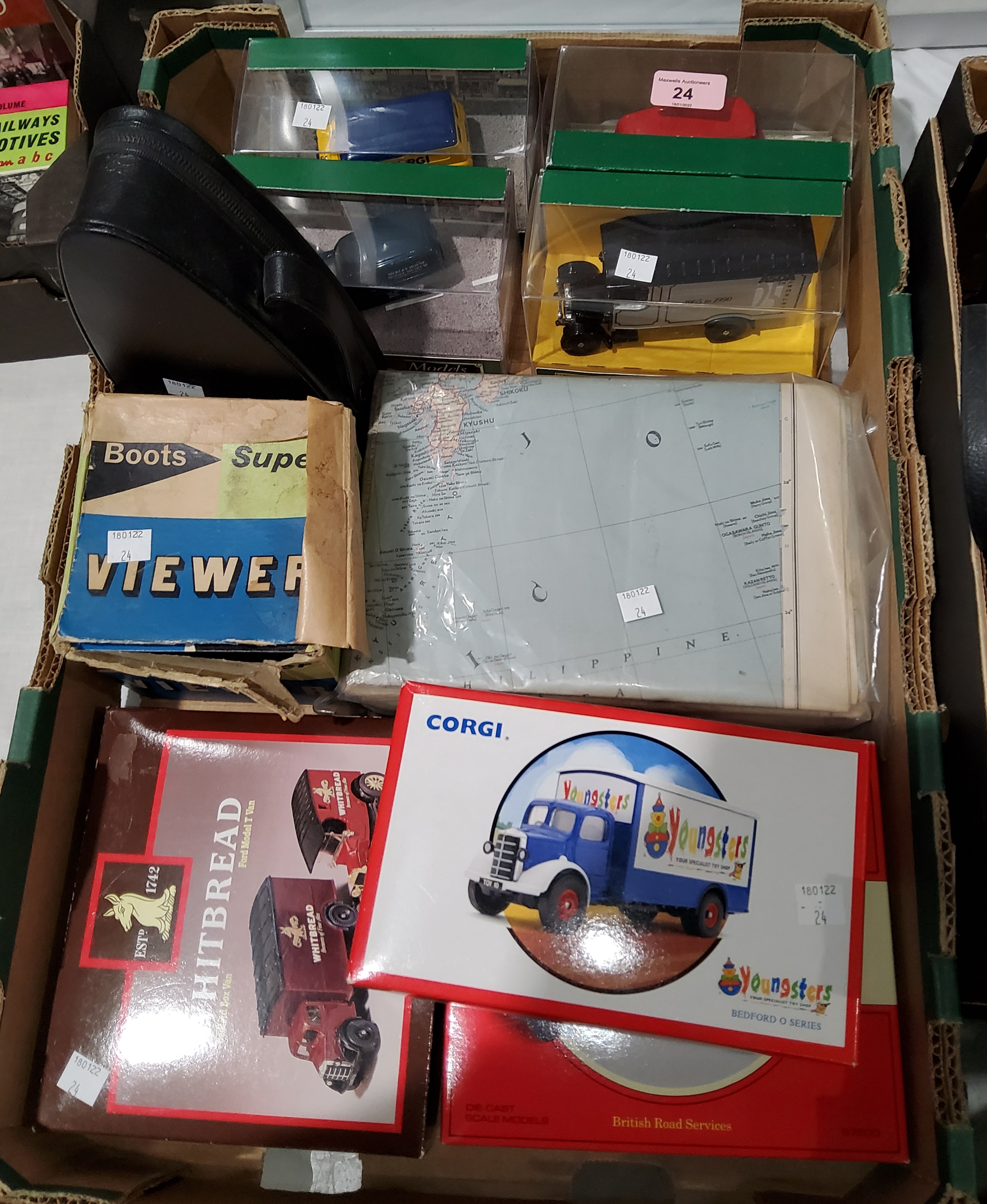 Seven Corgi vehicles, boxed; a metronome; a slide viewer; old maps