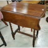 A modern nest of 3 light oak occasional tables; an oak drop leaf occasional table on barley twist