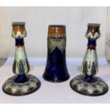 A pair of Doulton Lambeth Art Nouveau style stoneware candlesticks, decorated with stylised leaves