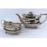 A silver Regency boat shaped teapot and matching sugar basin, London 1810, maker Samuel Hennell,