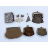 A selection of early 20th century coin purses, silver covered Aide Memoire, a pair of spectacles and