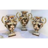 A 19th century Crown Derby garniture of 3 classical urn shaped vases with twin handles and