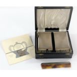 A gent's pair of silver back hairbrushes, with comb, cased; a QEII 1977 souvenir note clip