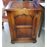 An 18th century style distressed oak cupboard in the manner of Titchmarsh & Goodwin, enclosed by a