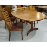 A 1960's G Plan dining suite comprising oval extending dining table, extended length 210cm and a set