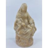 A 19th century Italian alabaster group of the Virgin, Christ and infant St John, on integral