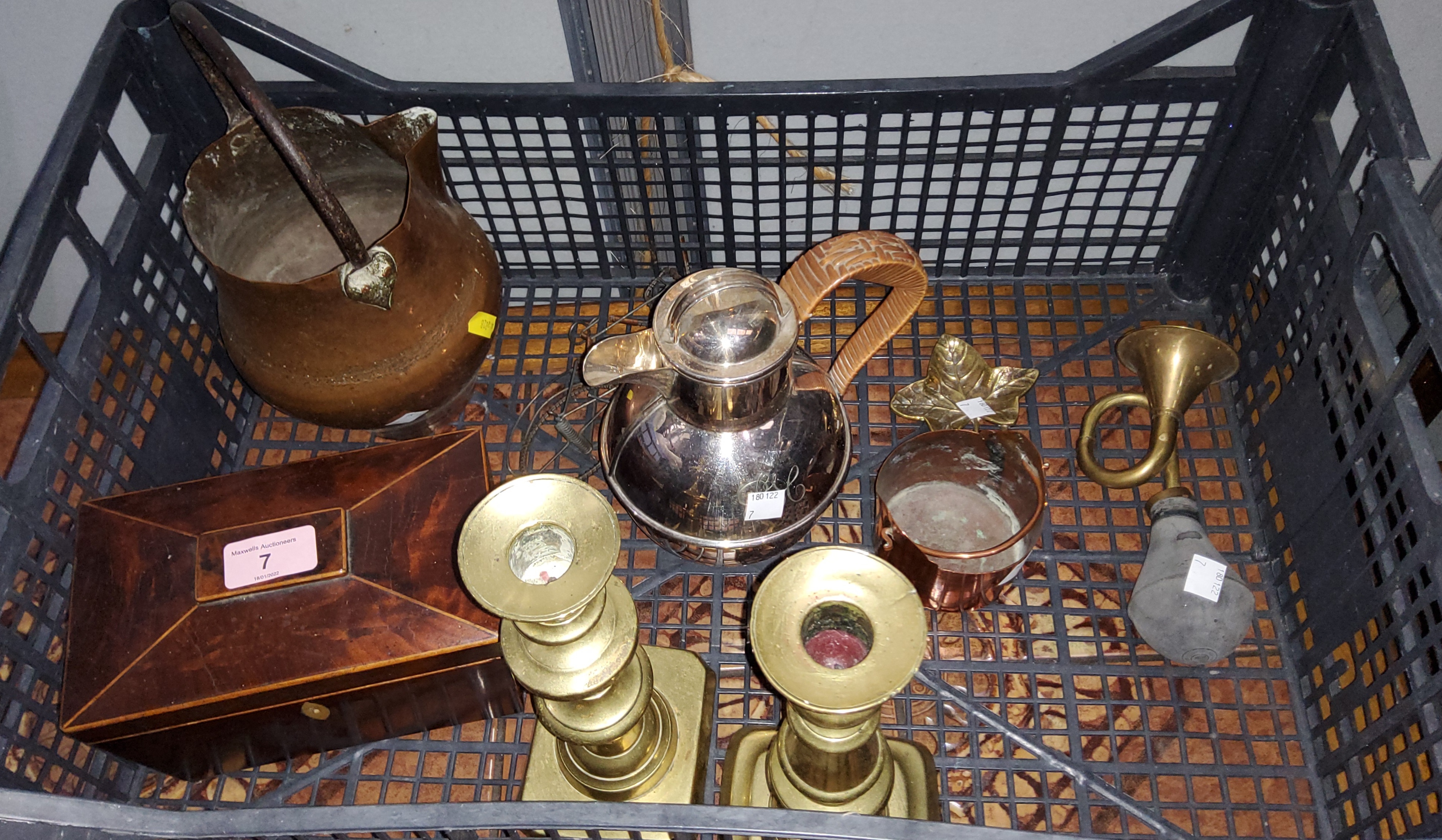 A mahogany veneered two section tea caddy boxwood inlay; 2 brass candlesticks and other metalware