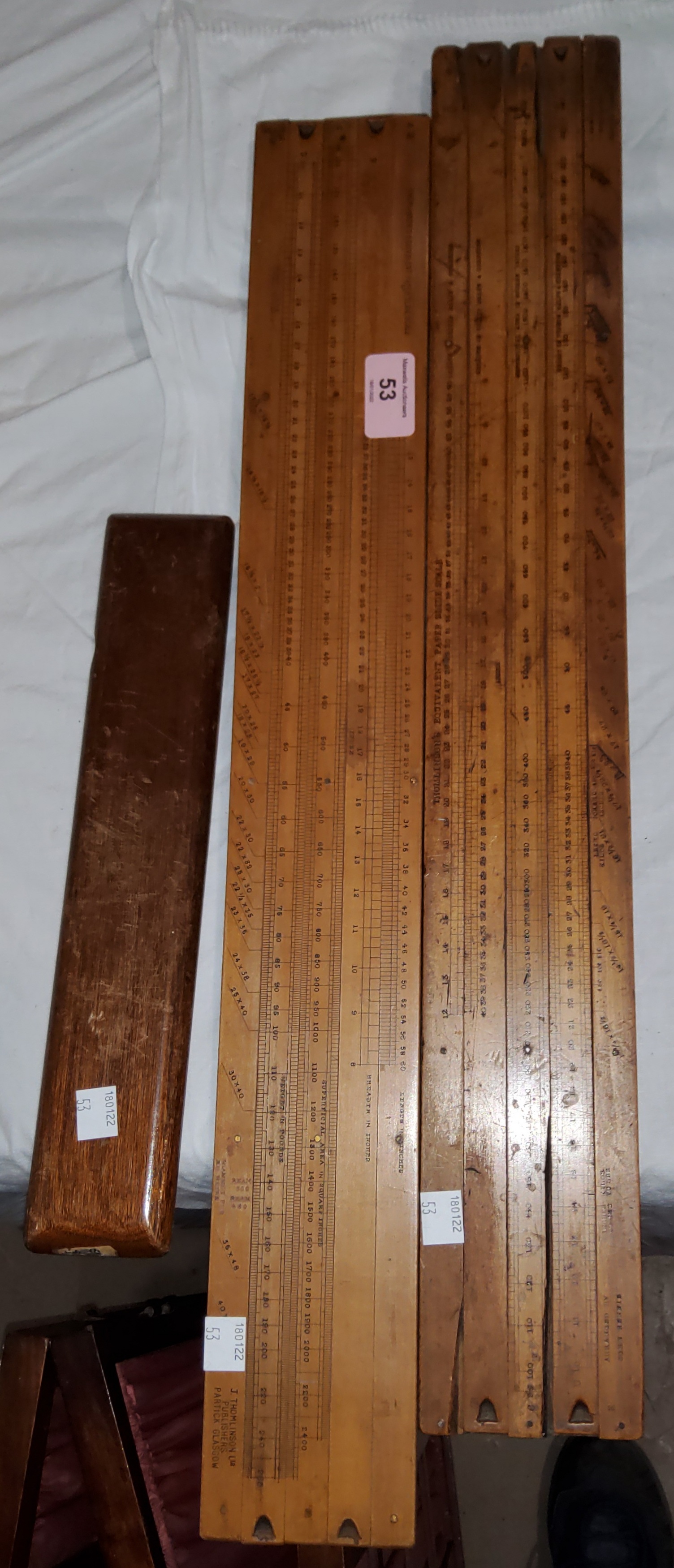 A boxwood slide rule, Tomlinson's Equivalent, 59 cm; another; a DIWA slide rule