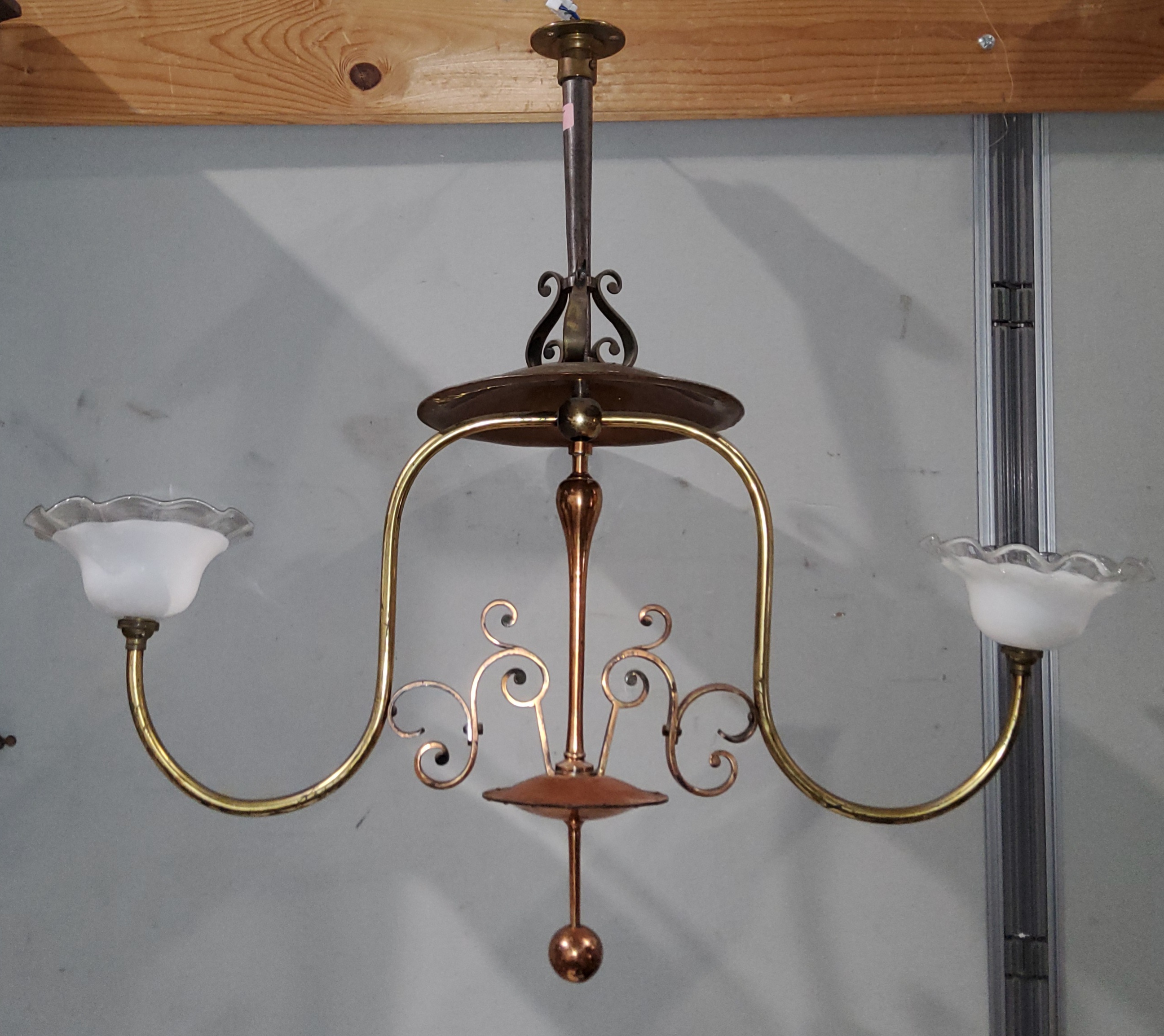 An early 20th century pendant ceiling light, Arts & Crafts design, copper and brass with wrought
