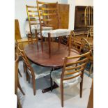 A 1960's rosewood dining suite comprising oval extending dining table, one leaf, extended length
