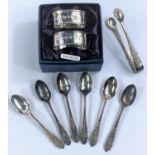 A set of hallmarked silver coffee spoons and tongs, Sheffield 1900; a pair of hallmarked silver