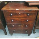 A Georgian figured mahogany commode with hinged top and front panel, 4 false drawer fascias with