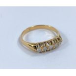 A ladies gold gypsy style dress ring set 5 graduating diamonds, size M