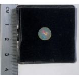 A circular cabochon cut opal, 2.20 carat