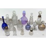 A collection of scent bottles some with silver collars