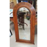 A mahogany arch framed bevel edge glass mirror ht.84cm