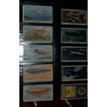 A selection of various vintage transport cigarette cards, including planes, ships, trains etc