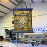 A 19th century large brass hanging hall lantern with leaded glass decoration with amber coloured