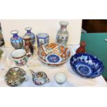 A selection of oriental china:  2 Chinese famille rose teapots; an Imari dish; an Indo/Persian