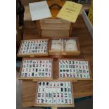A mid 20th century, oak cased, Mahjong set, with instructions etc.