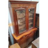 A Victorian mahogany full height bookcase with moulded cornice and 2 glazed doors over frieze drawer