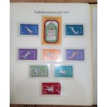 A World Cup 1974 album of world stamps and sets.