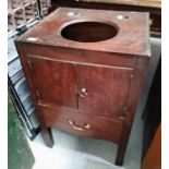 A mid Georgian mahogany washstand, the inner top recessed for a bowl, double cupboard and drawer