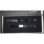 A Sheaffer 300 Series chrome and black fountain pen and ball point pen