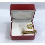 A gilt metal cased watch and strap; a Cartier Morocco box; vintage jewellery etc.