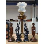 A Corinthian column reeded brass oil lamp with milk glass shade; a 19th century pair of spelter