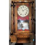 A marquetry cased American wall clock with bell chime (in need of some care and attention)