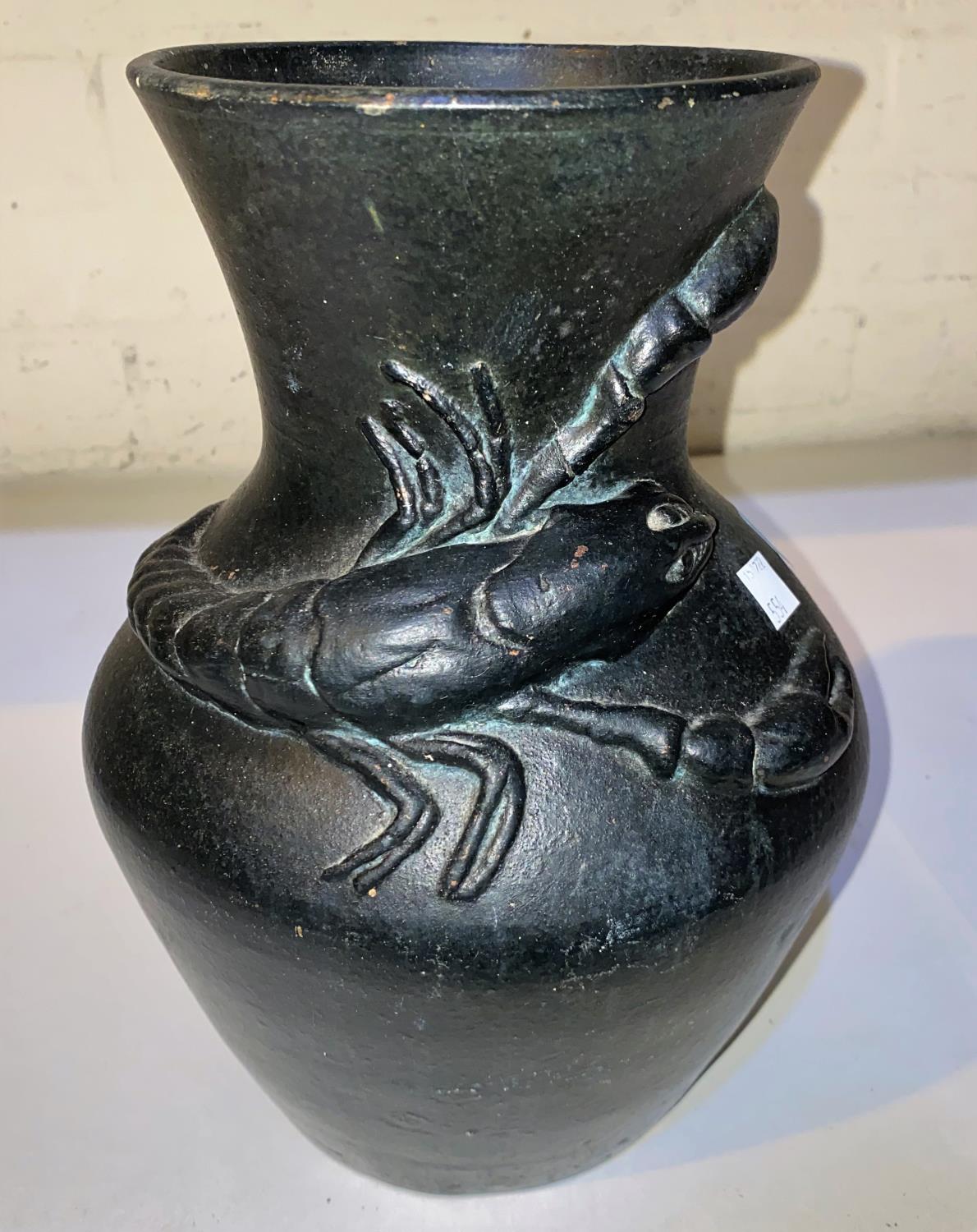 A Japanese pottery vase of bulbous form with lobster in relief under a 'bronzed' effect glaze