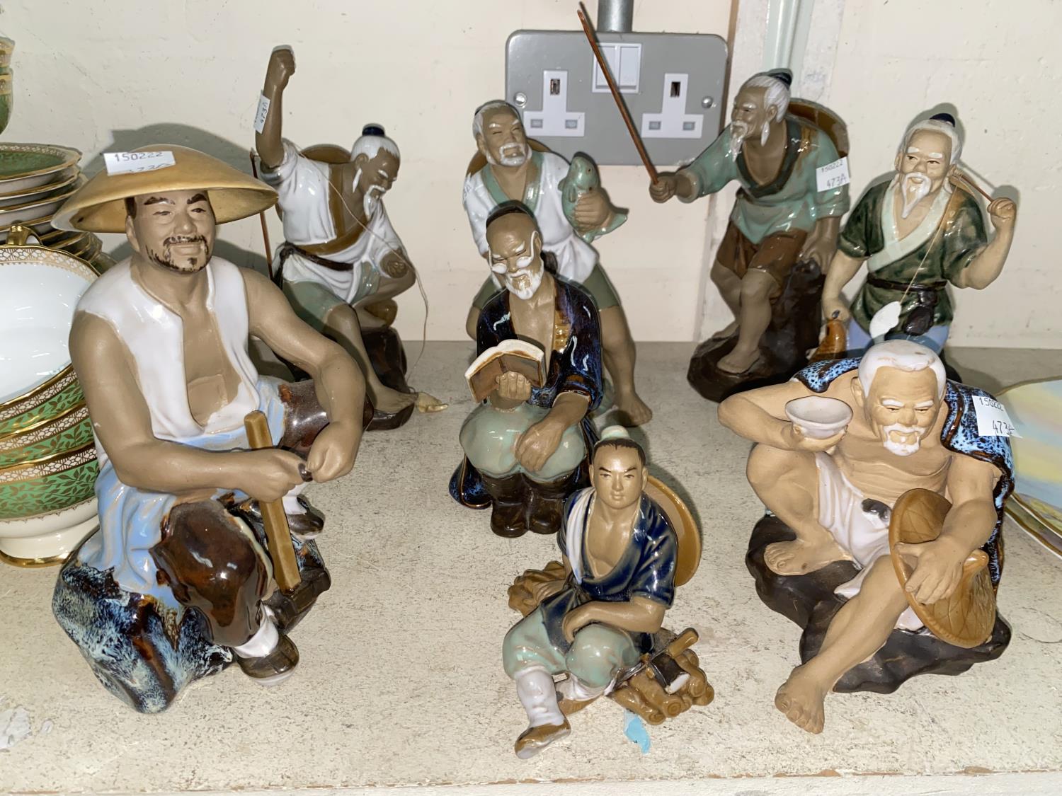 A selection of Chinese ceramic fishermen.