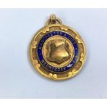 A 9ct gold 1920's Manchester and District Wednesday A.F.L Champions enamelled medal 6gms